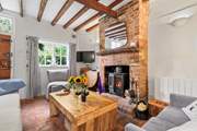 The cosy sitting/dining-room with an inviting wood-burner for those chilly afternoons and evenings.