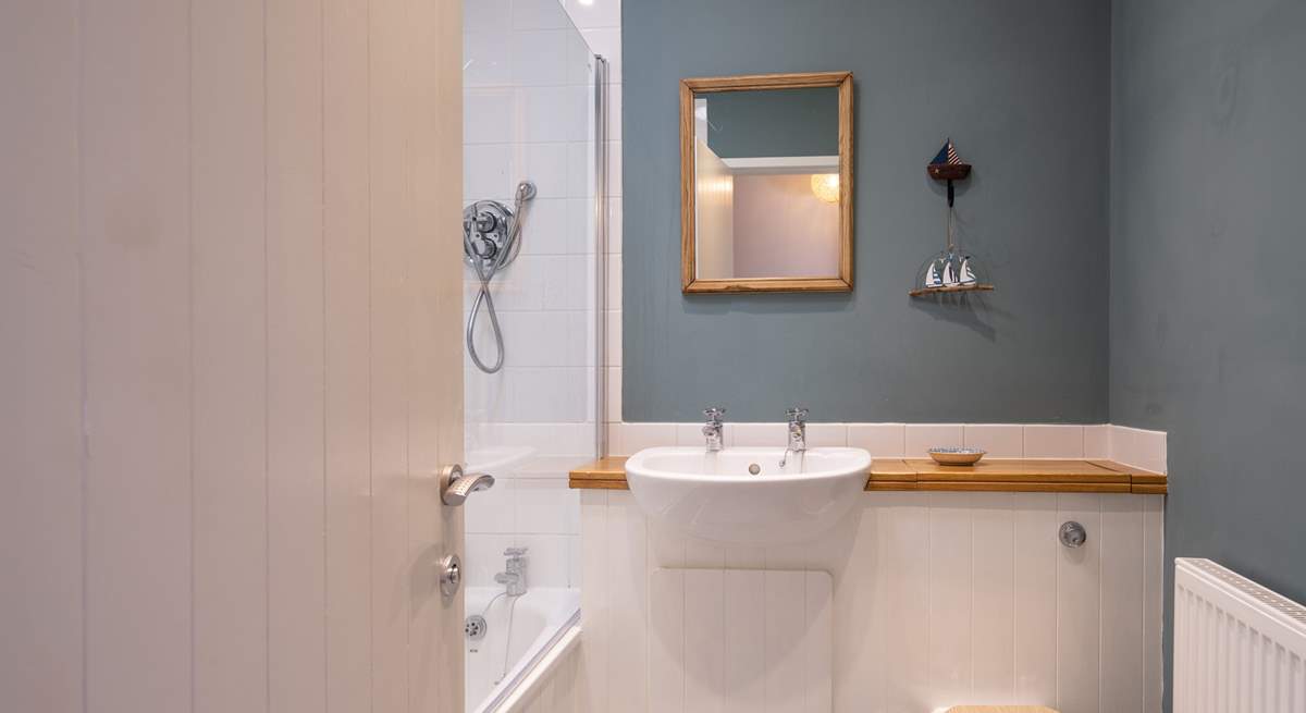 Your stylish bathroom has a shower over the bath.