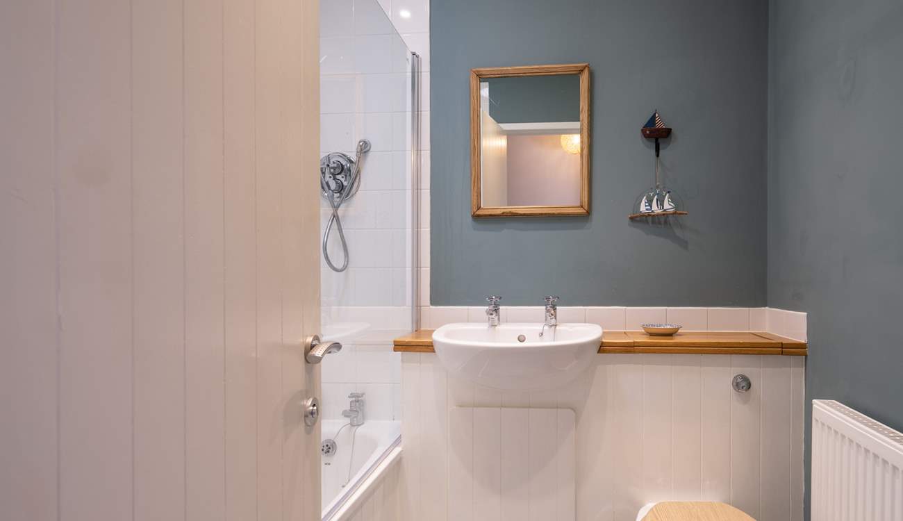 Your stylish bathroom has a shower over the bath.