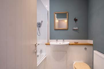Your stylish bathroom has a shower over the bath.