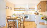 Gather everyone around the dining table to chat about the day ahead.  - Thumbnail Image