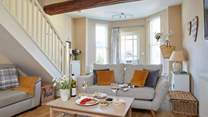 The sitting-room area of the open plan ground floor has space to relax, read and enjoy an afternoon glass of wine.