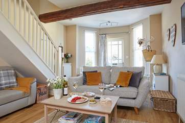 The sitting room area of the open plan ground floor has space to relax, read and enjoy an afternoon glass of wine.