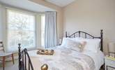 The pretty main bedroom is furnished with a king-size double bed. - Thumbnail Image