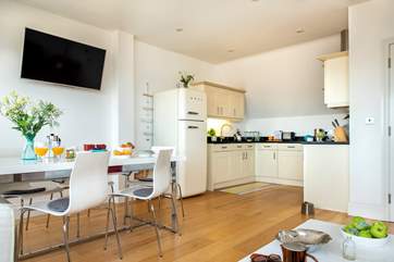 The open plan living-room is wonderfully light and airy and a great place for all to gather.