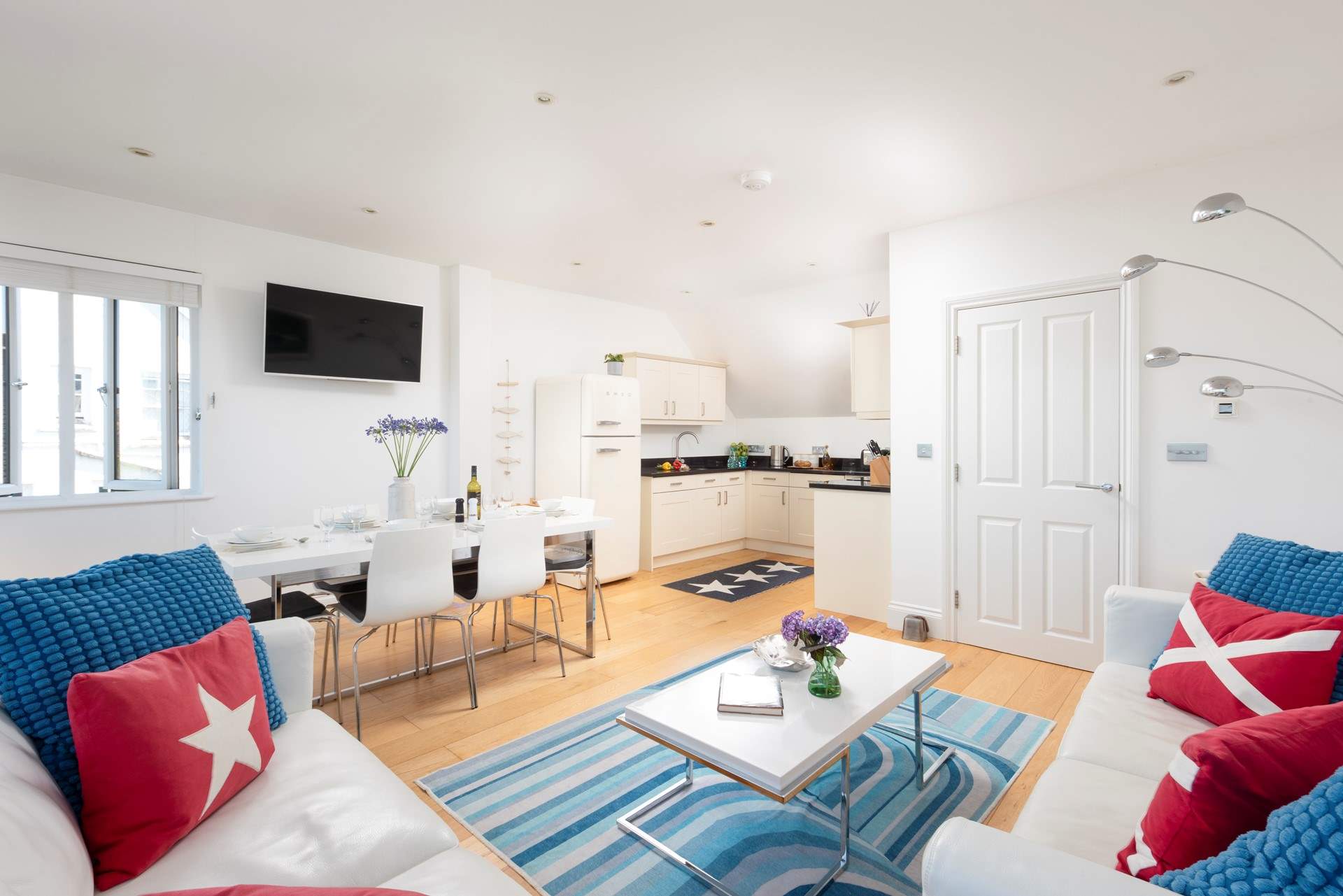 The open plan living-room is wonderfully light and airy and a great place for all to gather.