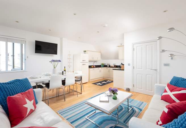 The open plan living-room is wonderfully light and airy and a great place for all to gather.