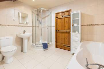 The bathroom has a bath and separate shower. Mind the step to the shower.