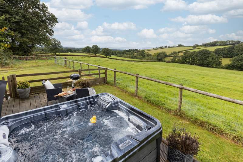 Look out over the Devonshire countryside from the bubbling hot tub.