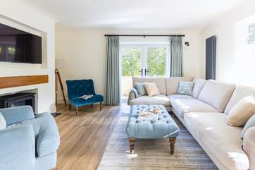 Luxurious furnishings in relaxing tones welcome you into the sitting/dining-room.