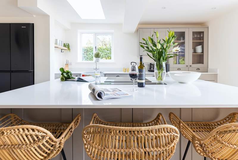 Light and bright, the lovely kitchen is a sociable space.