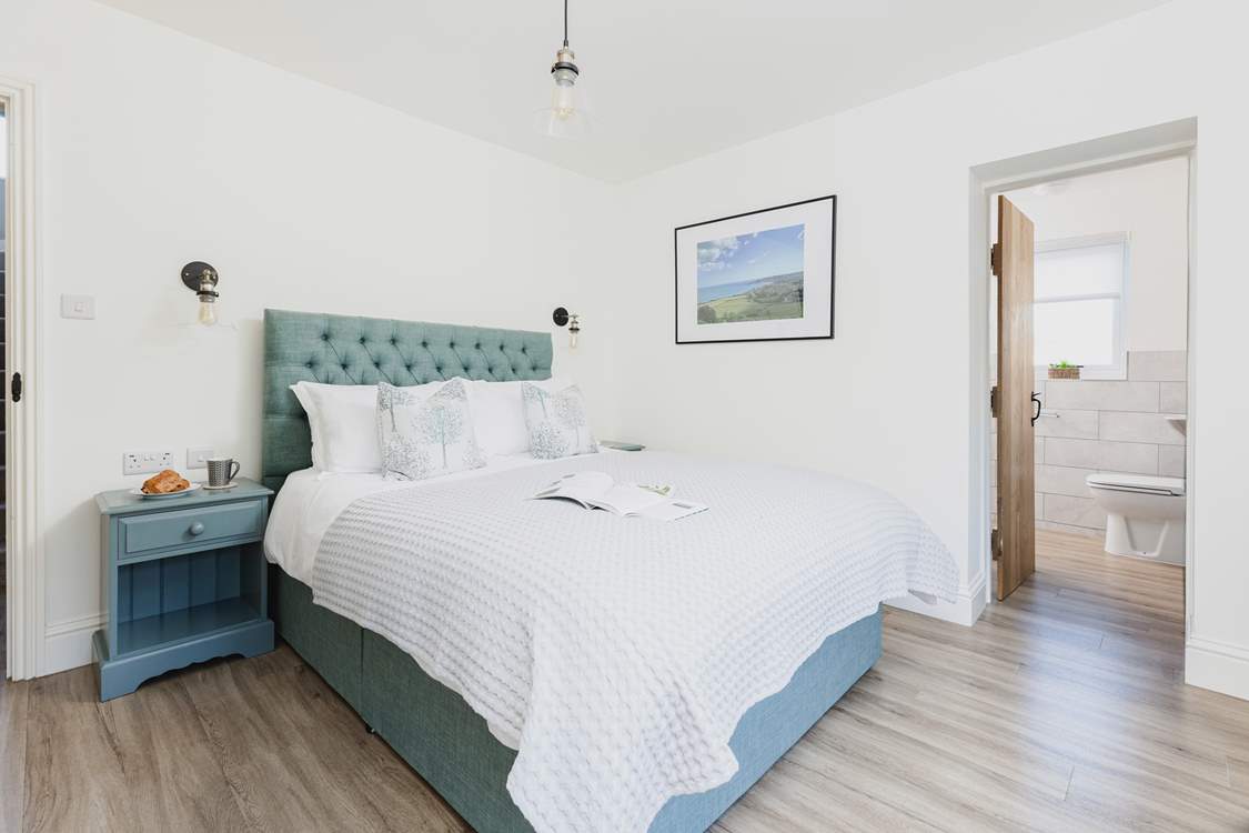 Tranquil colours and a super comfy king-size bed in bedroom 1.