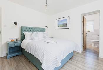 Tranquil colours and a super comfy king-size bed in bedroom 1.
