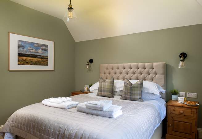 The third bedroom is beautifully styled.