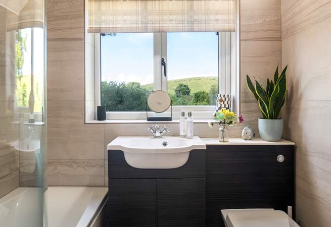 The family bathroom is spacious with stunning views.