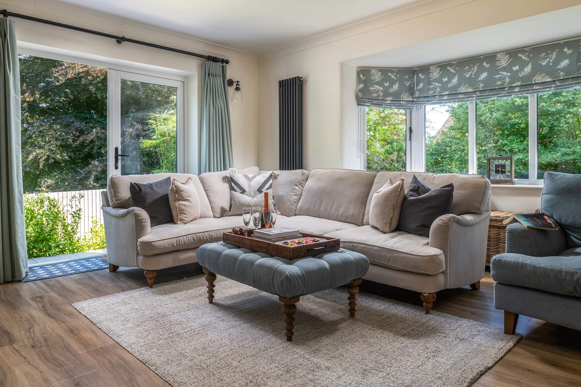 The grand sitting room is quite striking with plenty of comfy seating and natural light.