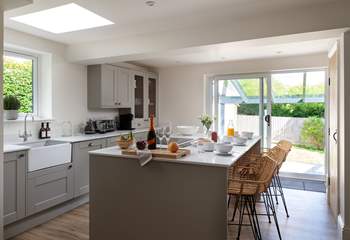The kitchen opens out to the garden and has a wonderful feature island.