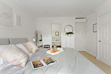 Super bedroom 2 is beautifully furnished in soft pastel shades.