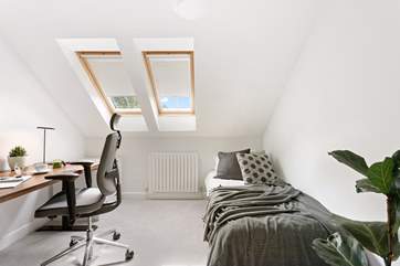 Bedroom 4 is a super light-filled single room with work space, just in case work calls.