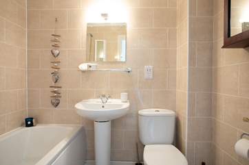 Have a relaxing bath in the family bathroom after a day out and about exploring.