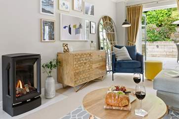 The gorgeous log-effect gas fire will keep you cosy during cooler months.