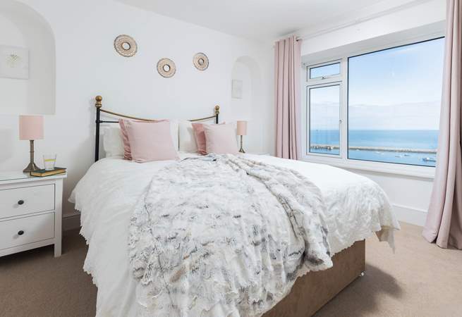 Bedroom one is home to a super inviting king-size bed. Perfect for those lazy mornings in bed, soaking up the incredible views.