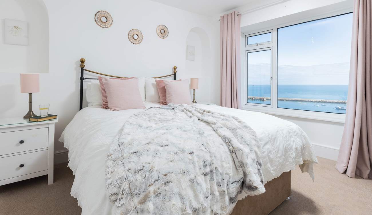 Bedroom one is home to a super inviting king-size bed. Perfect for those lazy mornings in bed, soaking up the incredible views.