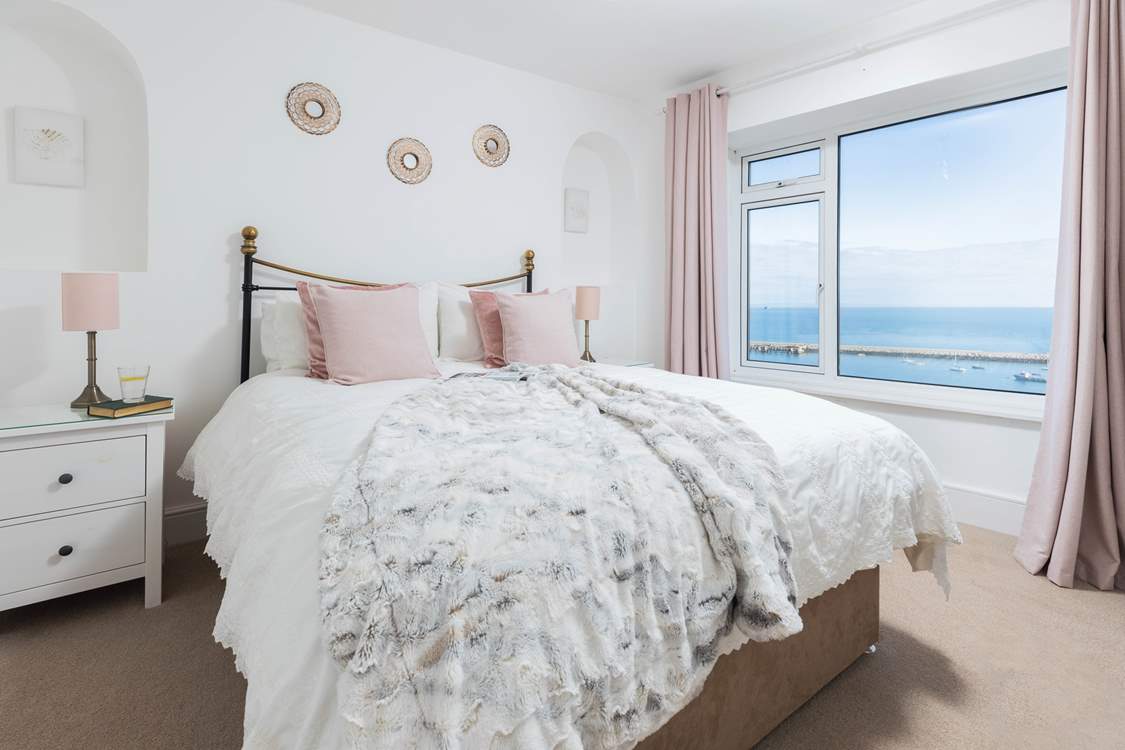 Bedroom one is home to a super inviting king-size bed. Perfect for those lazy mornings in bed, soaking up the incredible views.
