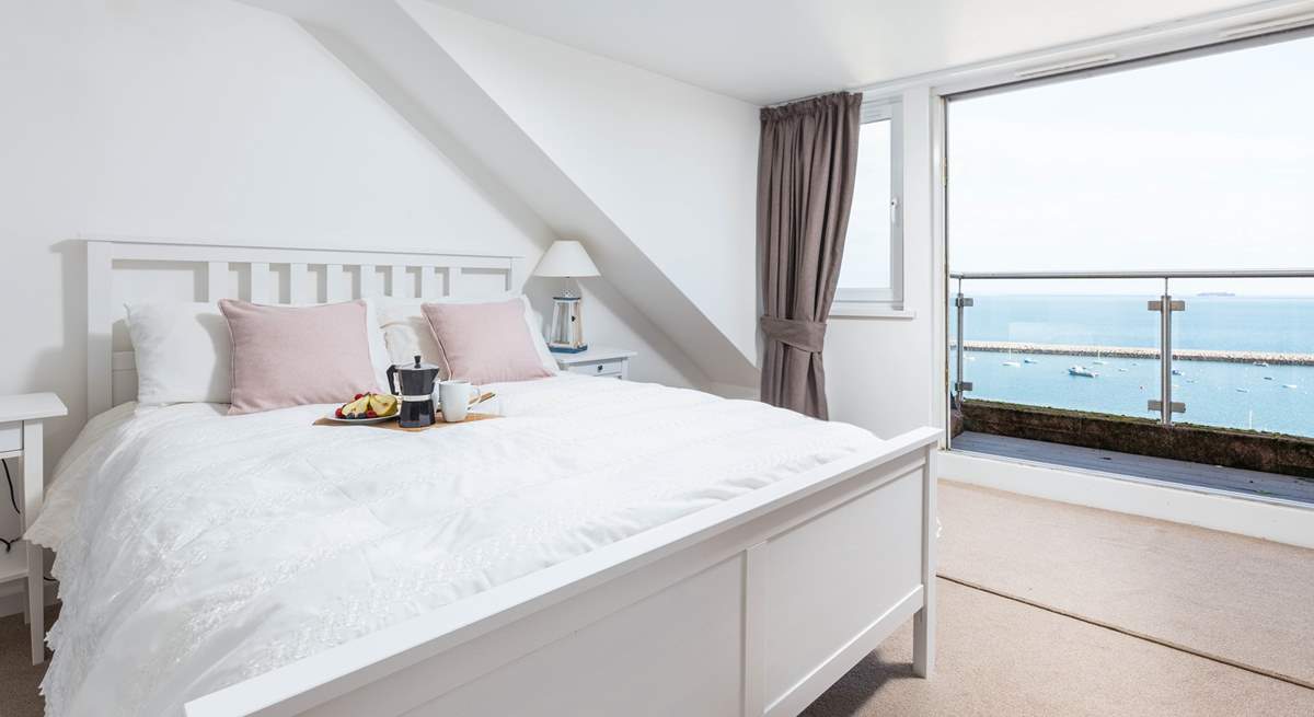 Bedroom three is home to this fabulous king-size bed, en suite and spectacular sea views, which can be enjoyed from your small balcony seating area. What a great spot to enjoy the morning paper.