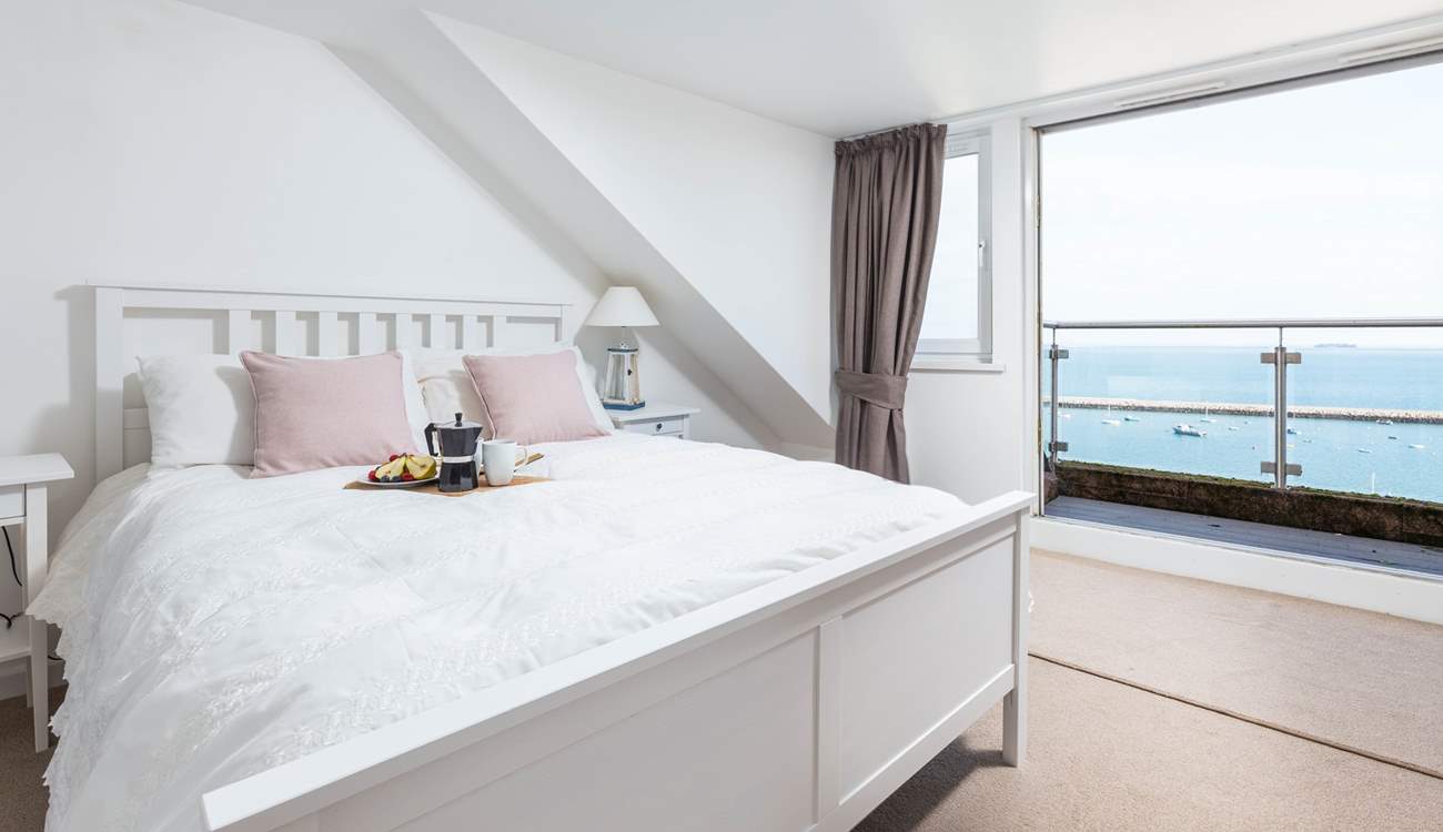 Bedroom three is home to this fabulous king-size bed, en suite and spectacular sea views, which can be enjoyed from your small balcony seating area. What a great spot to enjoy the morning paper.