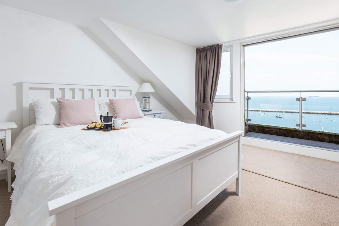 Bedroom three is home to this fabulous king-size bed, en suite and spectacular sea views, which can be enjoyed from your small balcony seating area. What a great spot to enjoy the morning paper.