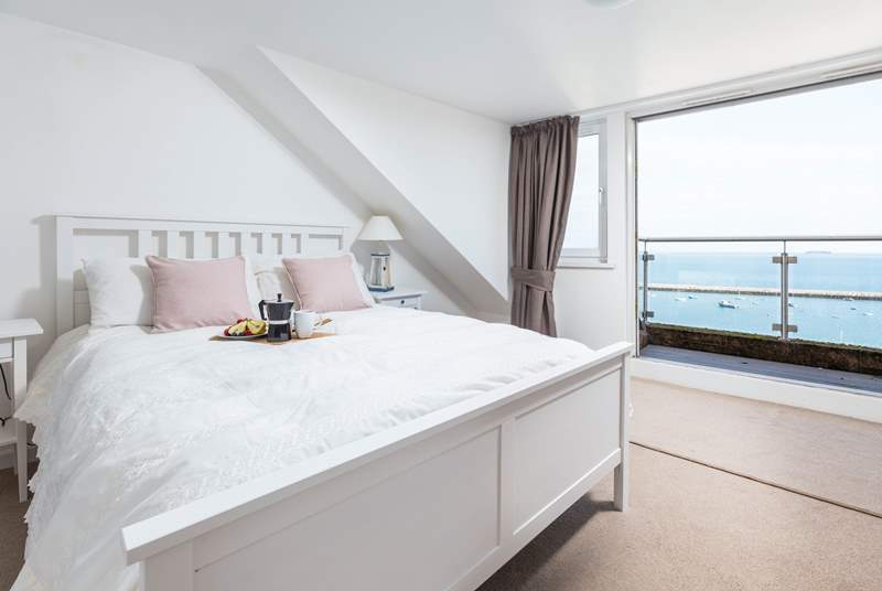 Bedroom three is home to this fabulous king-size bed, en suite and spectacular sea views, which can be enjoyed from your small balcony seating area. What a great spot to enjoy the morning paper.