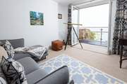 The sitting-room offers comfy seating to sit back and really soak up the view.