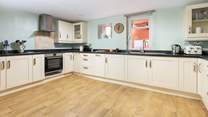 Venture down to the lower ground floor, and step into this rather spacious kitchen.