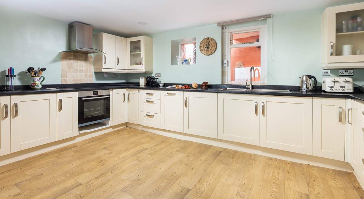 Venture down to the lower ground floor, and step into this rather spacious kitchen.