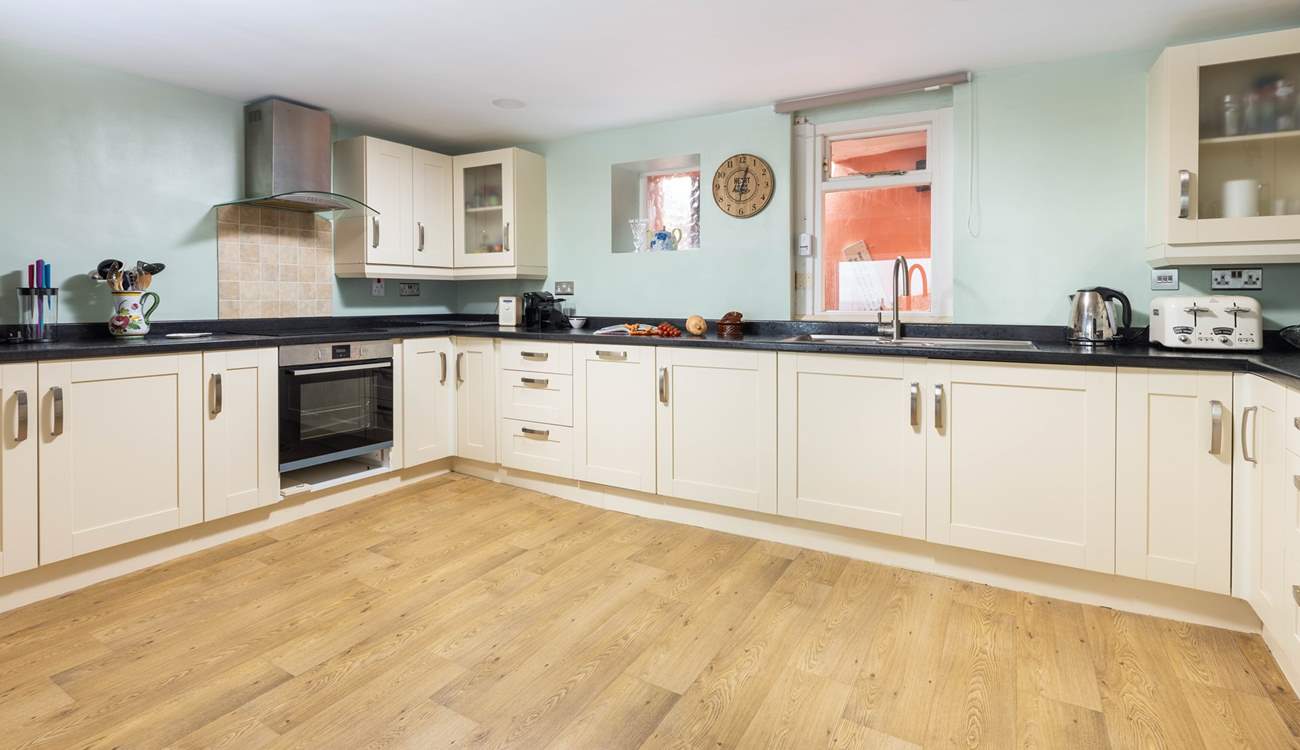Venture down to the lower ground floor, and step into this rather spacious kitchen.