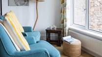 The lower ground floor kitchen and dining area also provide a comfy seating area. Soaking up the views with a good book is just the ticket.