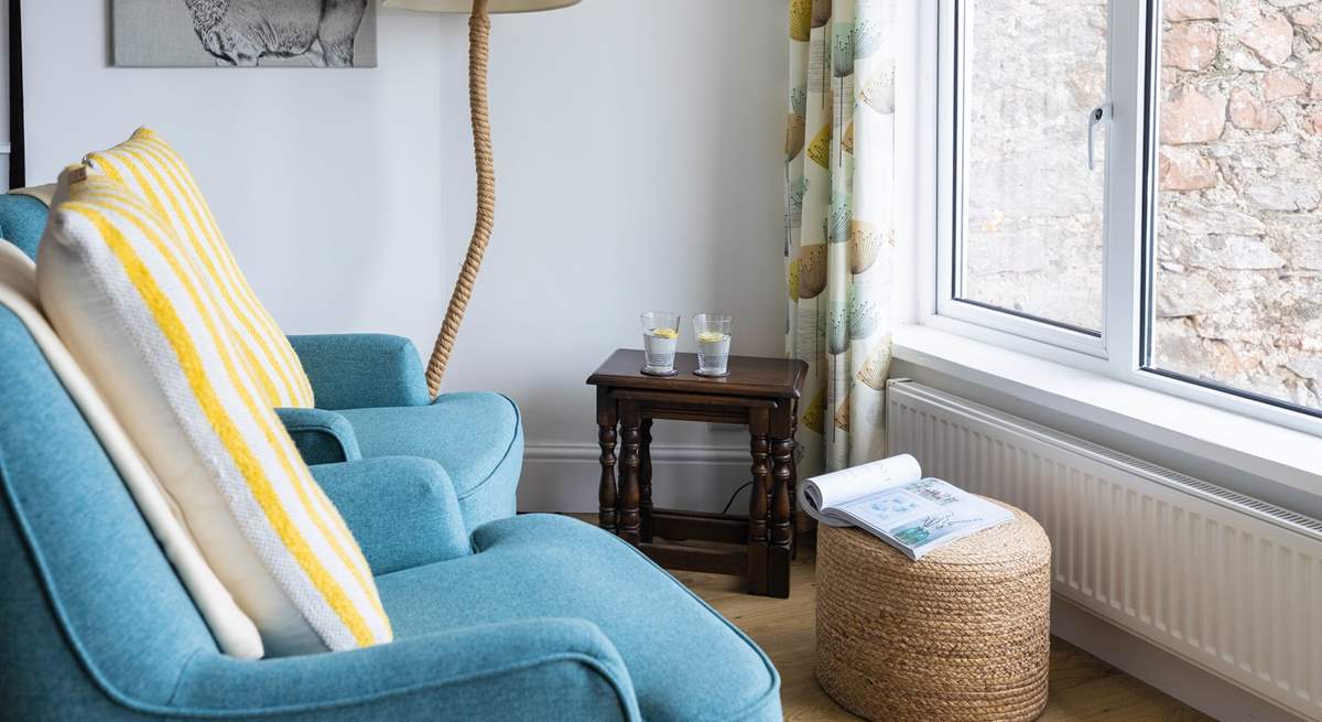 The lower ground floor kitchen and dining area also provide a comfy seating area. Soaking up the views with a good book is just the ticket.