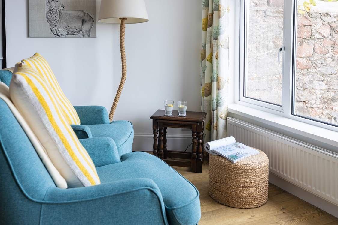 The lower ground floor kitchen and dining area also provide a comfy seating area. Soaking up the views with a good book is just the ticket.