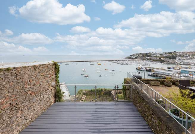 Step out of the kitchen, down a few steps, and onto your enclosed decked area. 