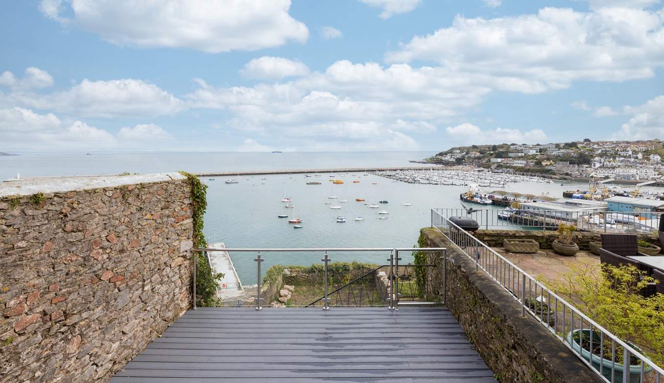 Step out of the kitchen, down a few steps, and onto your enclosed decked area. 