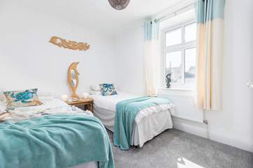 Coastal blues in the twin bedroom.