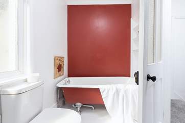 The family bathroom has a fabulous roll-top bath.