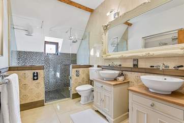 The most luxurious of bathrooms with twin sinks and showers!
