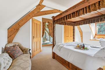 The lovely internal window looks down to the living area below.