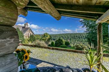 The view from the verandah takes in acres of woodland and Thimble Hall to the left.