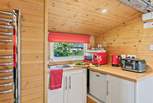 The small but perfectly formed kitchen area is in a separate cabin to the main lodge.