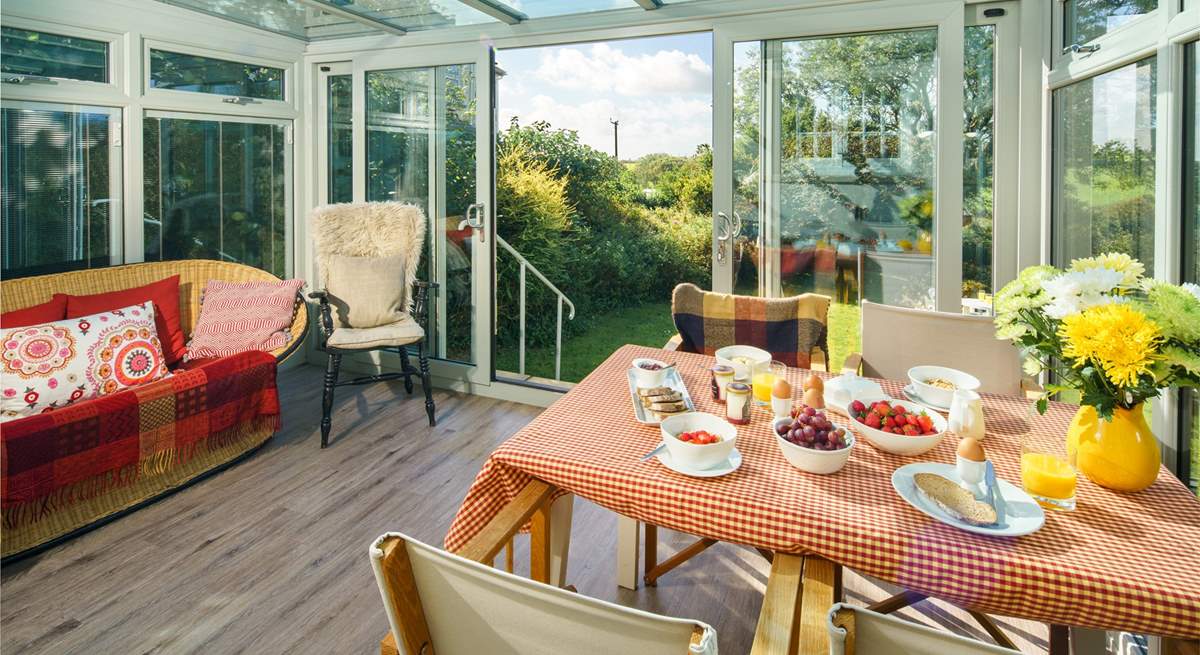 The sunny garden-room is the perfect spot for breakfast.