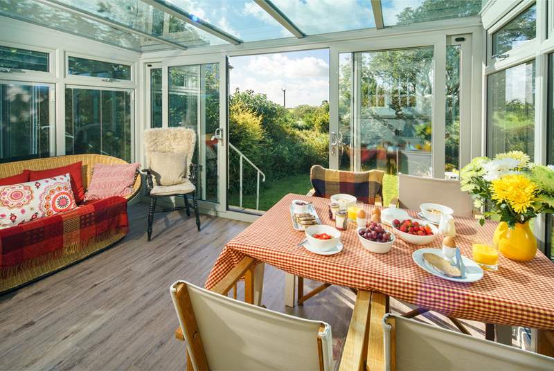 The sunny garden-room is the perfect spot for breakfast.