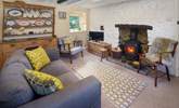 The sitting-room is full of charm and character - the perfect place to cosy up after exploring Pembrokeshire. - Thumbnail Image